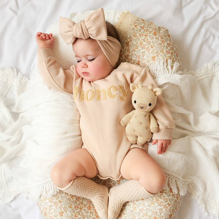 unisex baby oatmeal romper with honey text