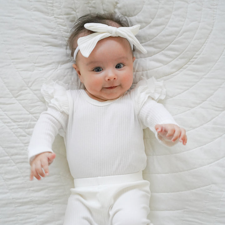baby girl white long sleeve bodysuit with flutter