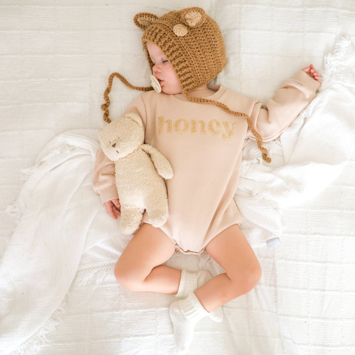 unisex baby oatmeal romper with honey text