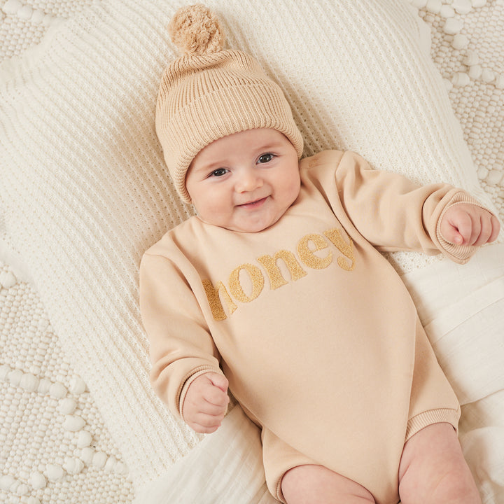 unisex baby oatmeal romper with honey text