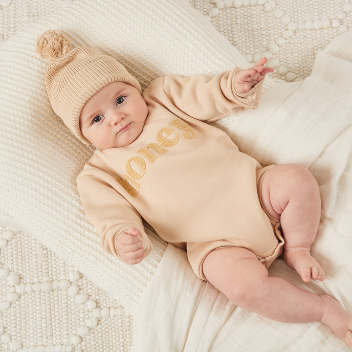 unisex baby oatmeal romper with honey text