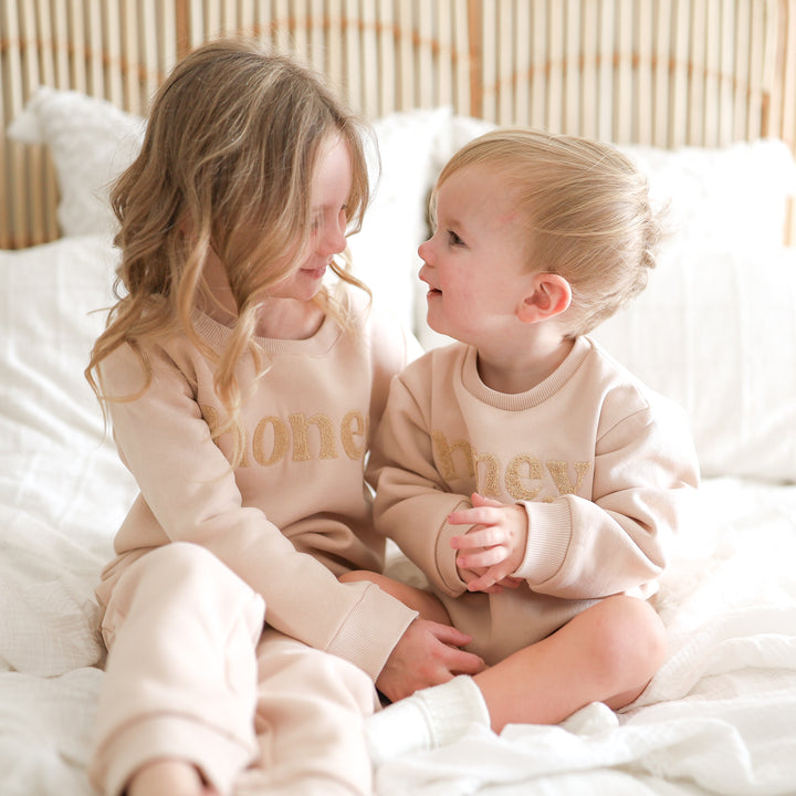 unisex baby oatmeal romper with honey text