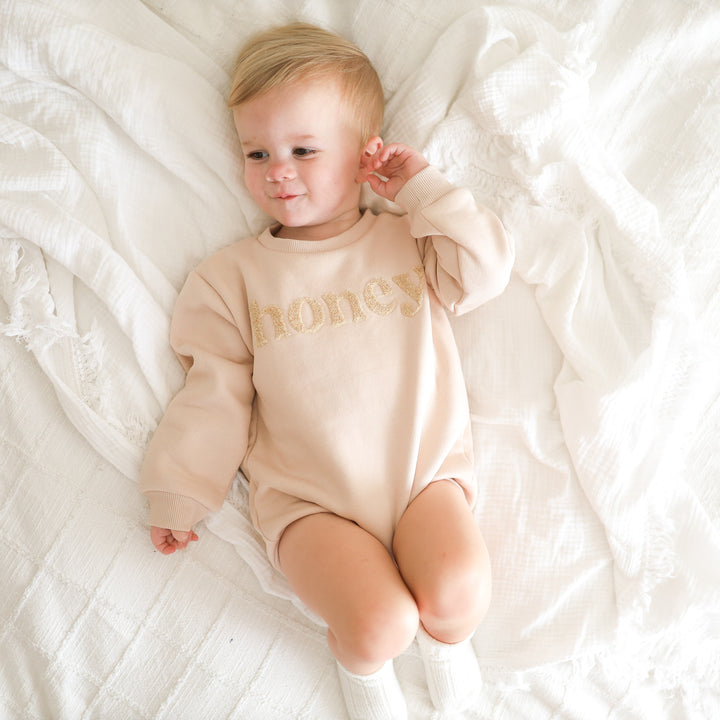 unisex baby oatmeal romper with honey text