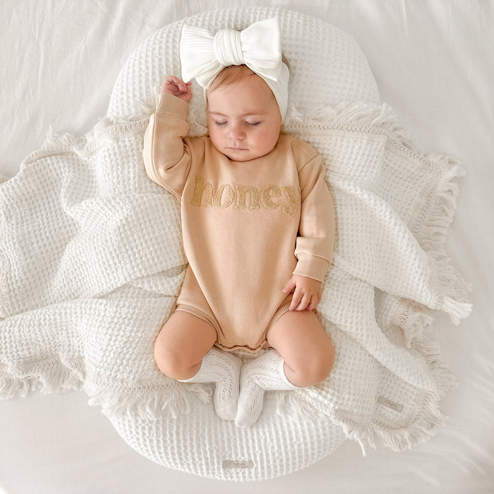 unisex baby oatmeal romper with honey text