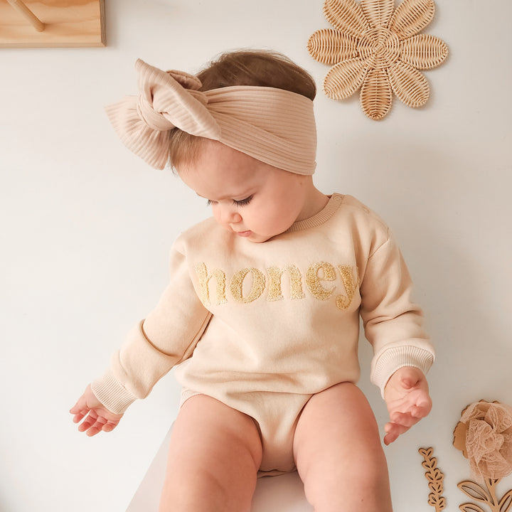 unisex baby oatmeal romper with honey text