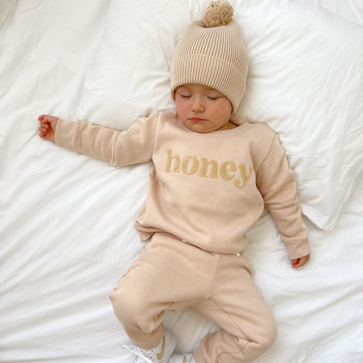 kids unisex oatmeal jumper with honey text