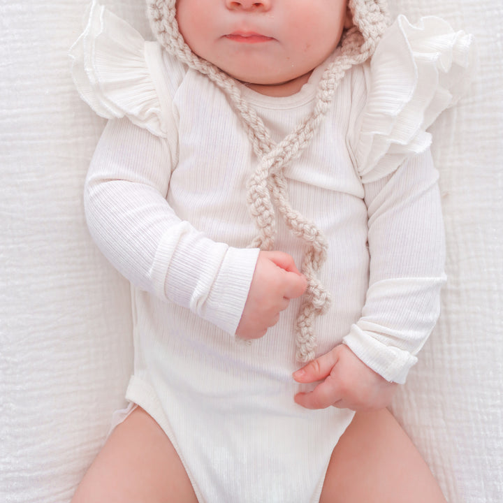 baby white long sleeve bodysuit with flutter