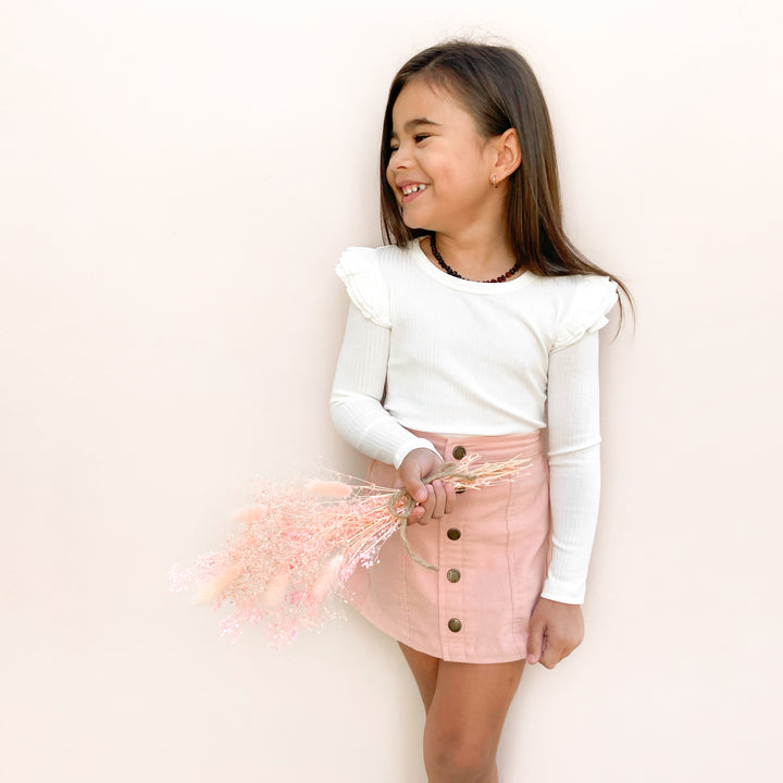 girls white long sleeve top with flutter