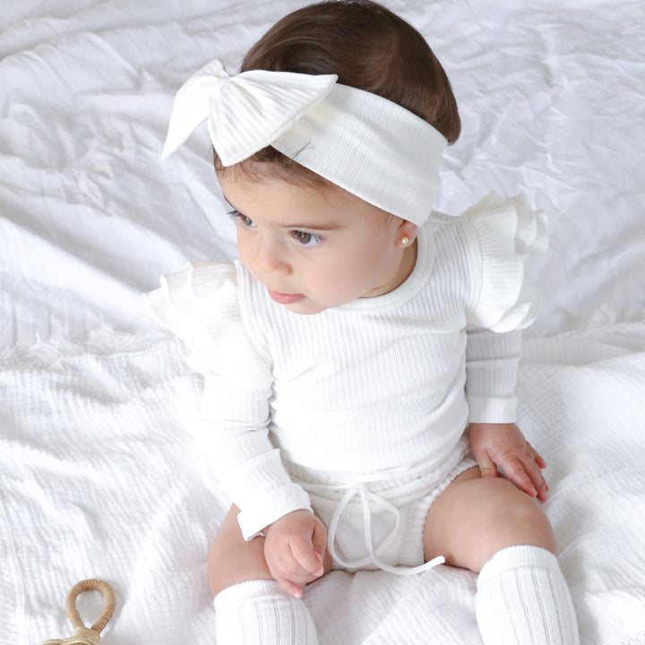 baby girl white long sleeve bodysuit with flutter