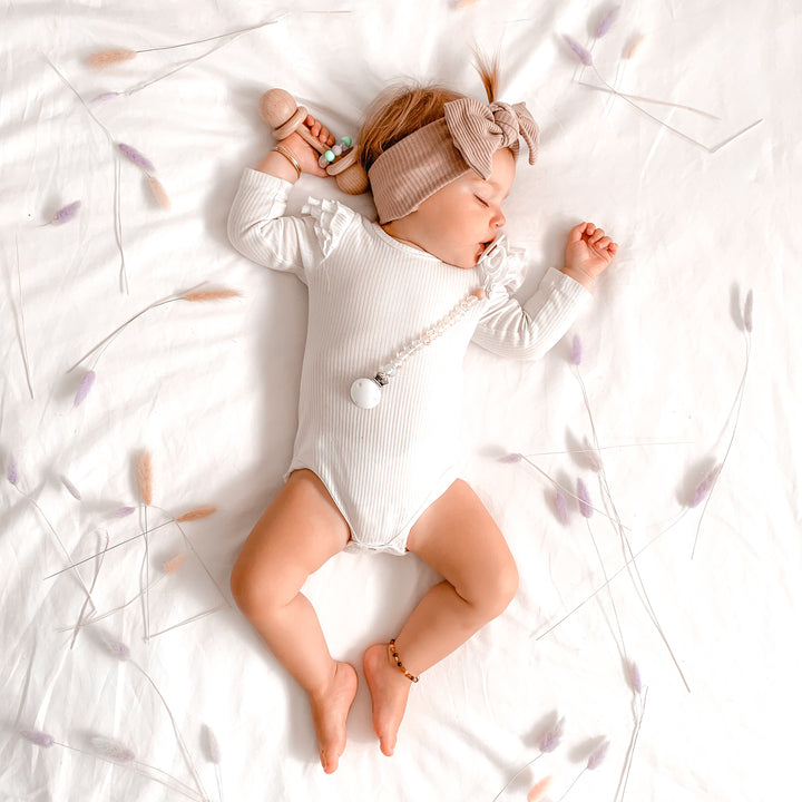 baby girl white long sleeve bodysuit with flutter