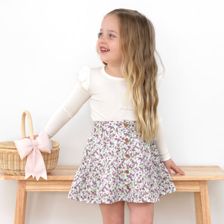 girls white long sleeve top with flutter