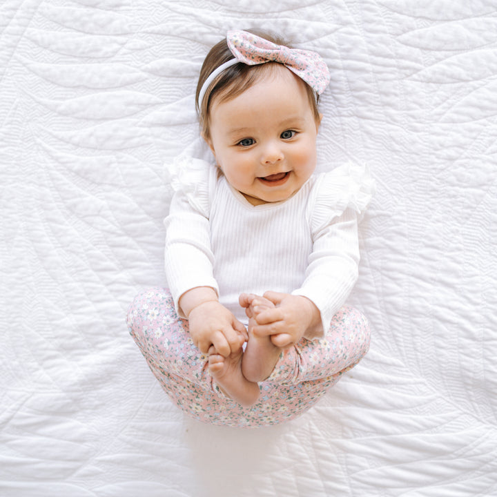 baby girl white long sleeve bodysuit with flutter