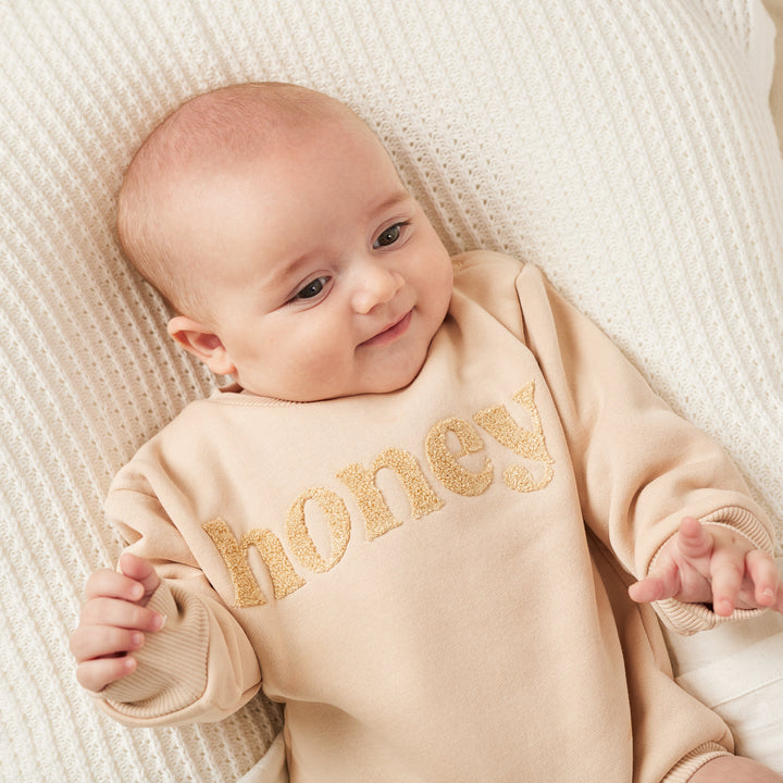 unisex baby oatmeal romper with honey text