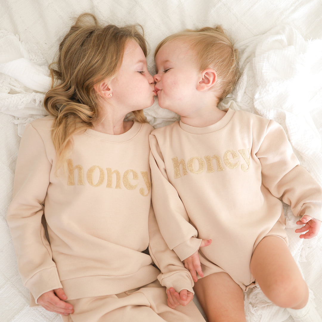 unisex baby oatmeal romper with honey text