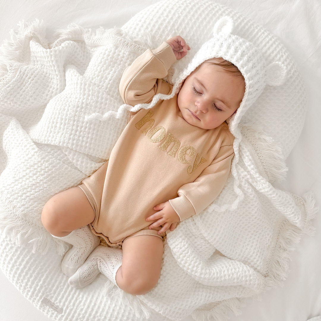unisex baby oatmeal romper with honey text
